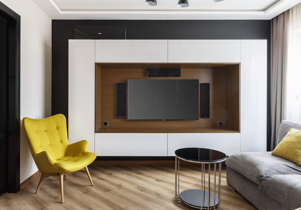 Современная стена с телевизором. Мебель вокруг телевизора. Шкаф для телевизора в гостиной. Телевизор в гостиной. Стенка для телевизора.