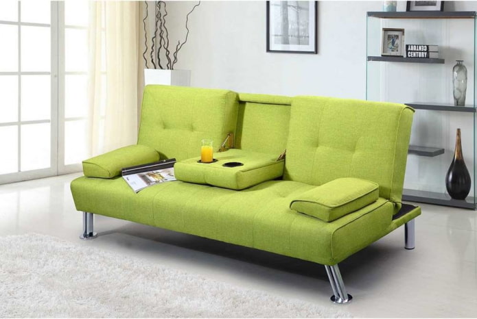 диван-книжка зеленого цвета в интерьере